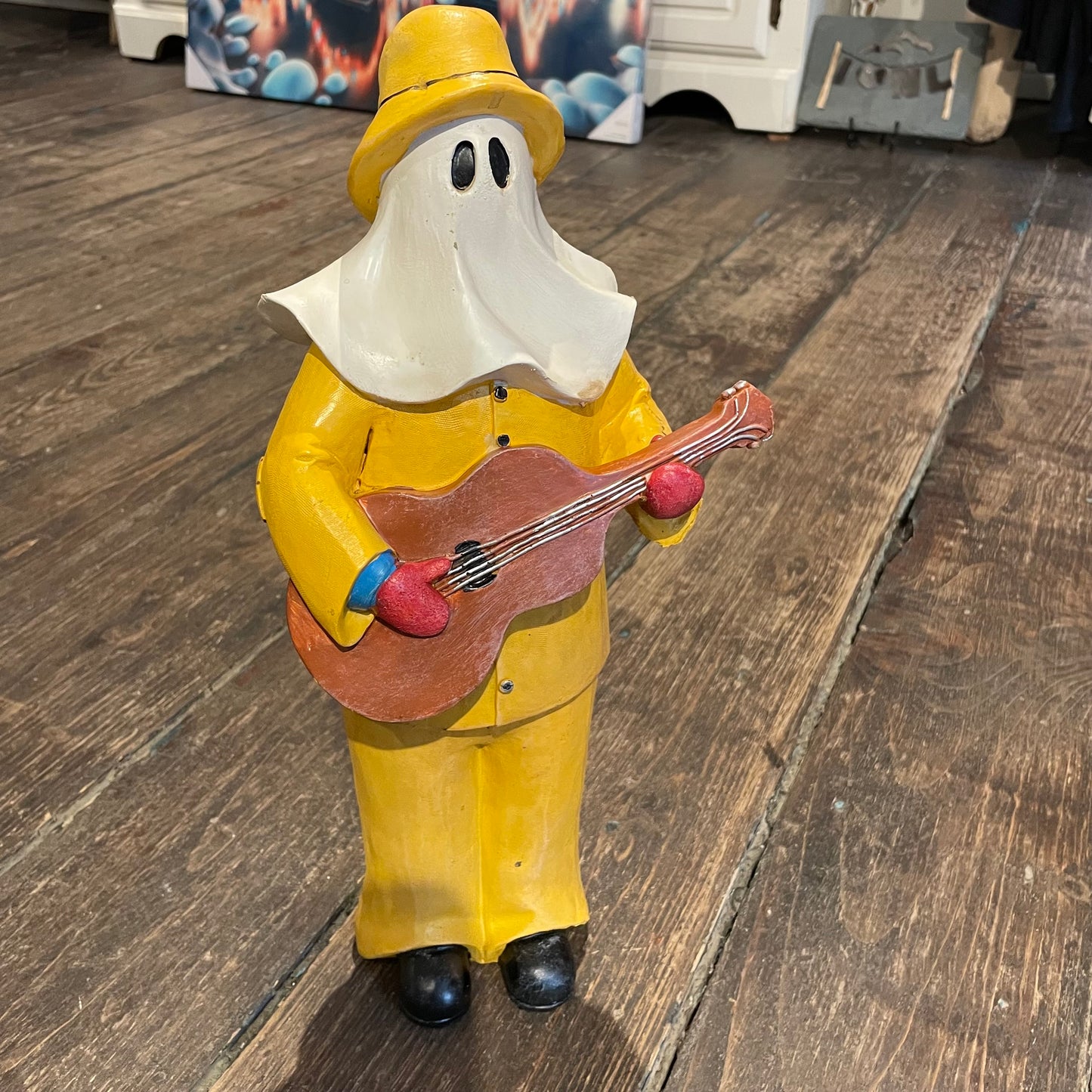 16" Mummer in His Oil Skins and Playing Guitar